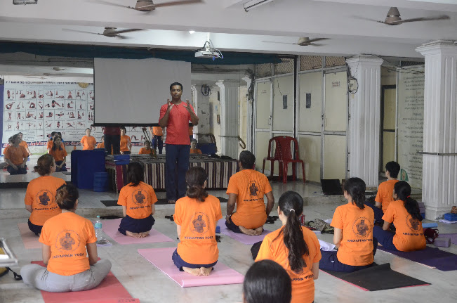 Students learning together at Andiappan Yoga School
